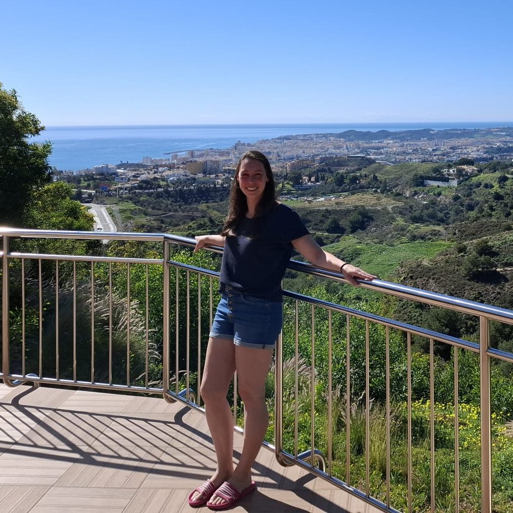 Kyra at Villa Sol y Viento, with the view over the green hills and the Costa del Sol coastline